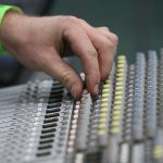 Photo of a music mixing board