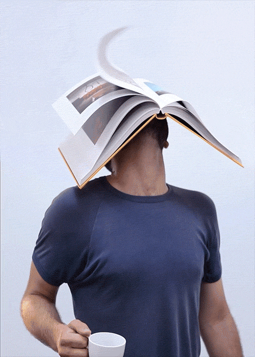 Cinemagraph portrait of man with a book on his head